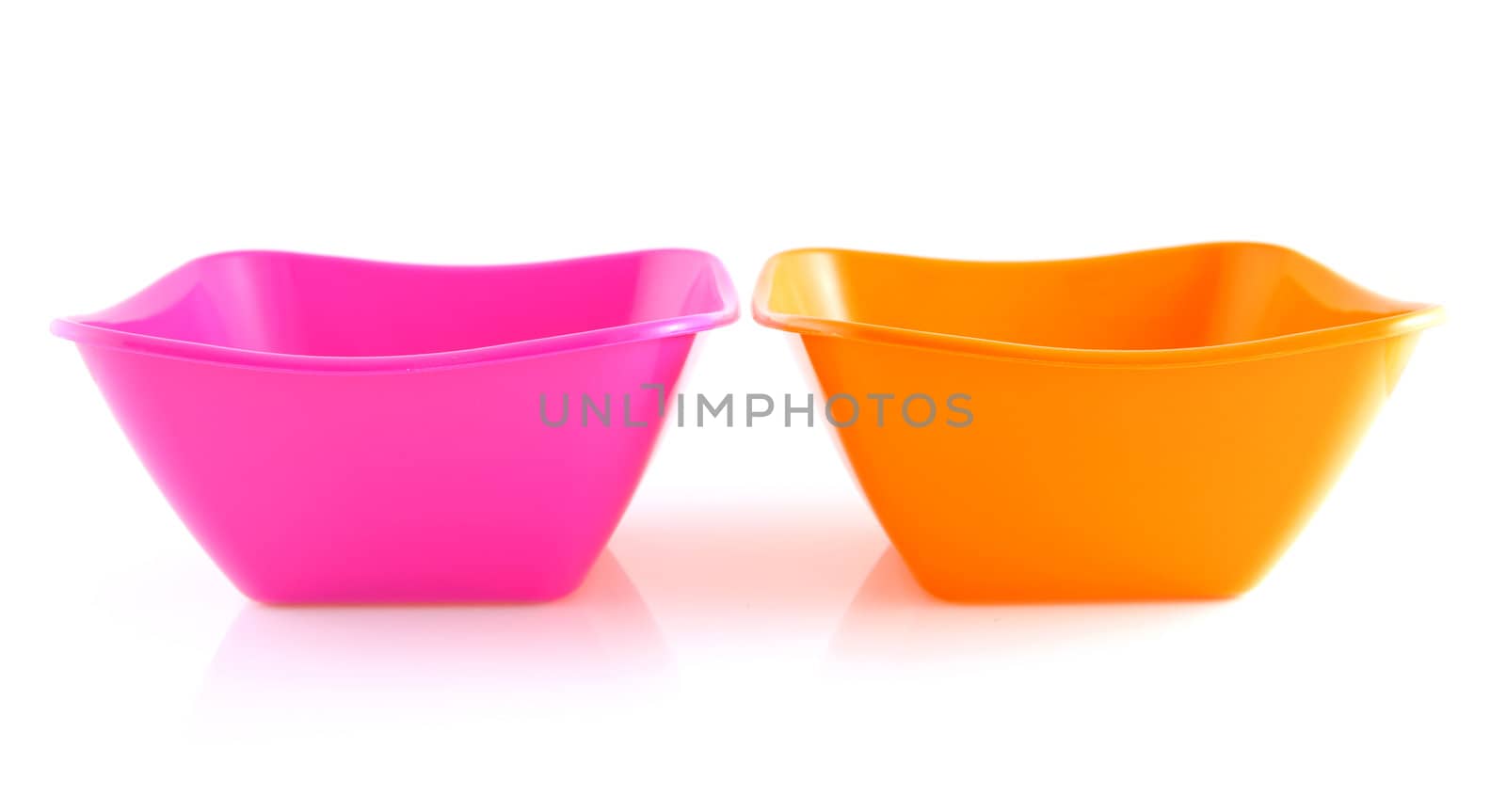 two colorful empty snack bowls over white background