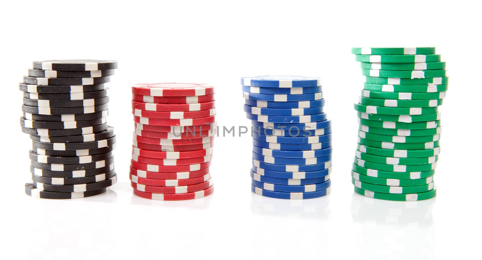 stacks of colorful poker casino chips over white background