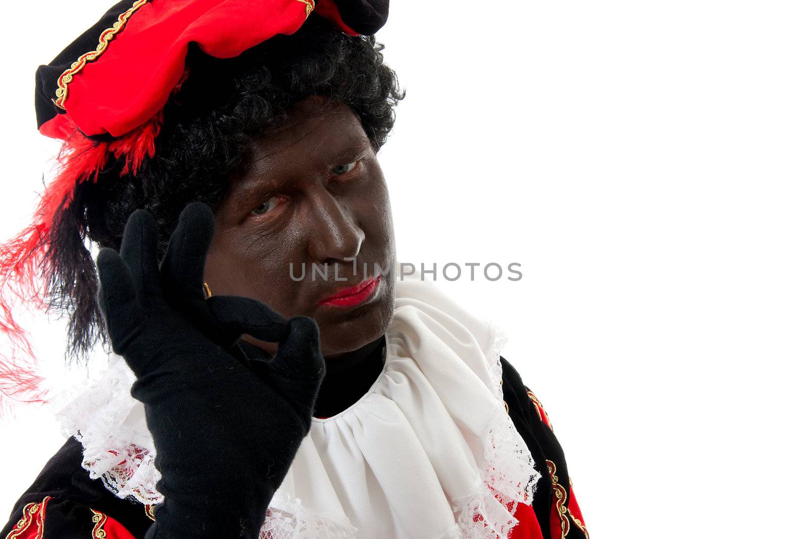 Zwarte piet ( black pete) typical Dutch character part of a traditional event celebrating the birthday of Sinterklaas in december over white background making OK sign