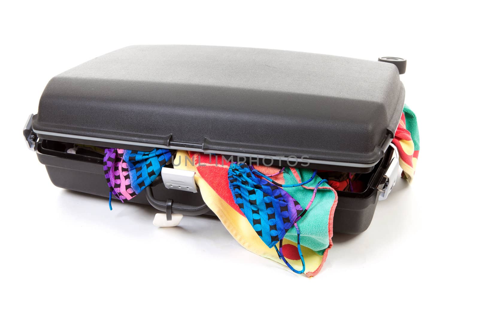 stuffed suitcase for vacation over white background