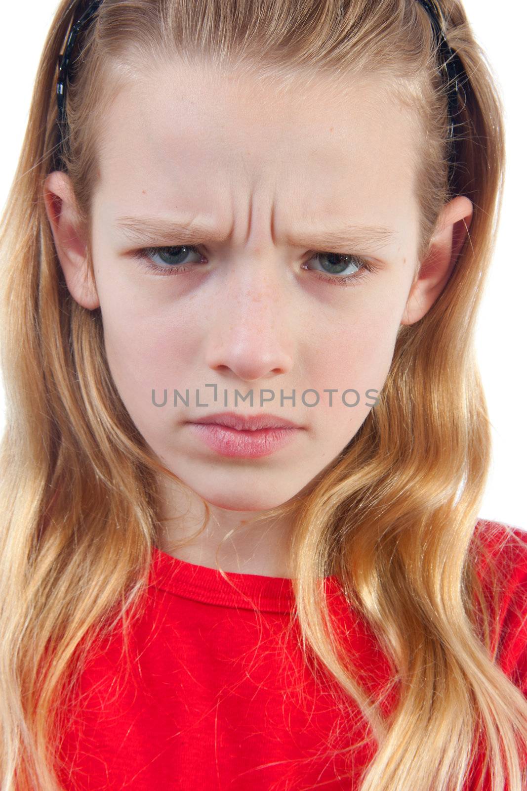 girl is angry, portrait in closeup, over white background