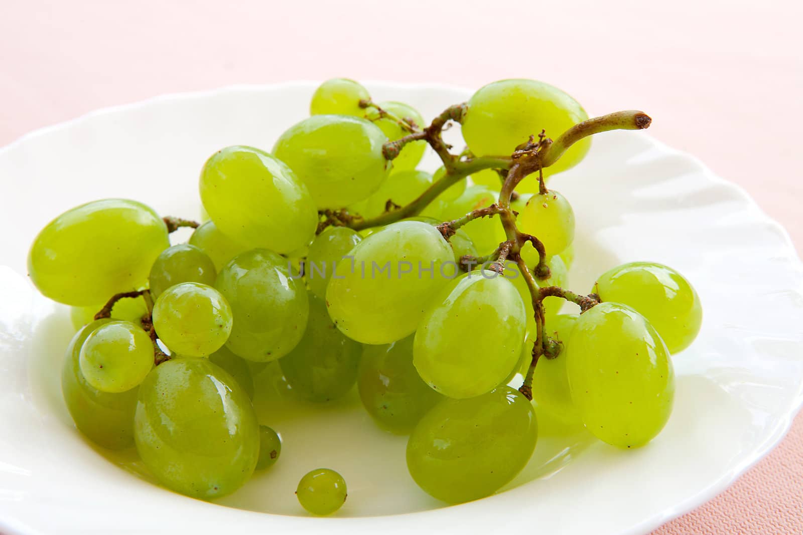 blanc grapes on white plate in closeup