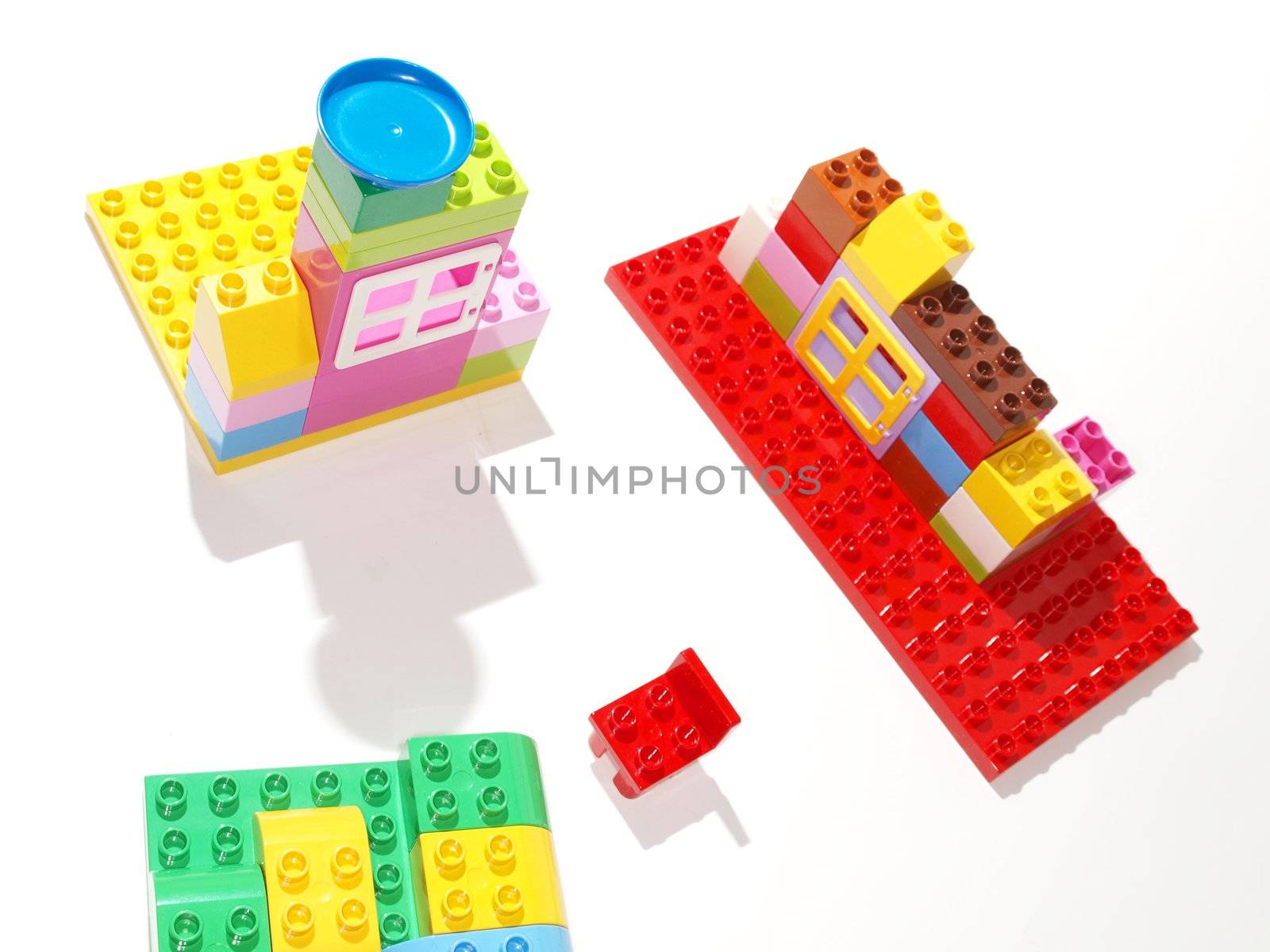 Colorful plastic quick build toys, towards white background