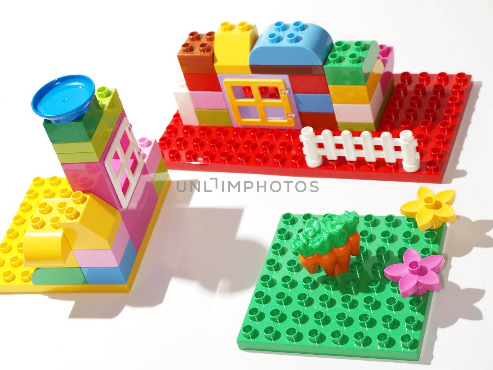 Colorful plastic quick build toys, towards white background