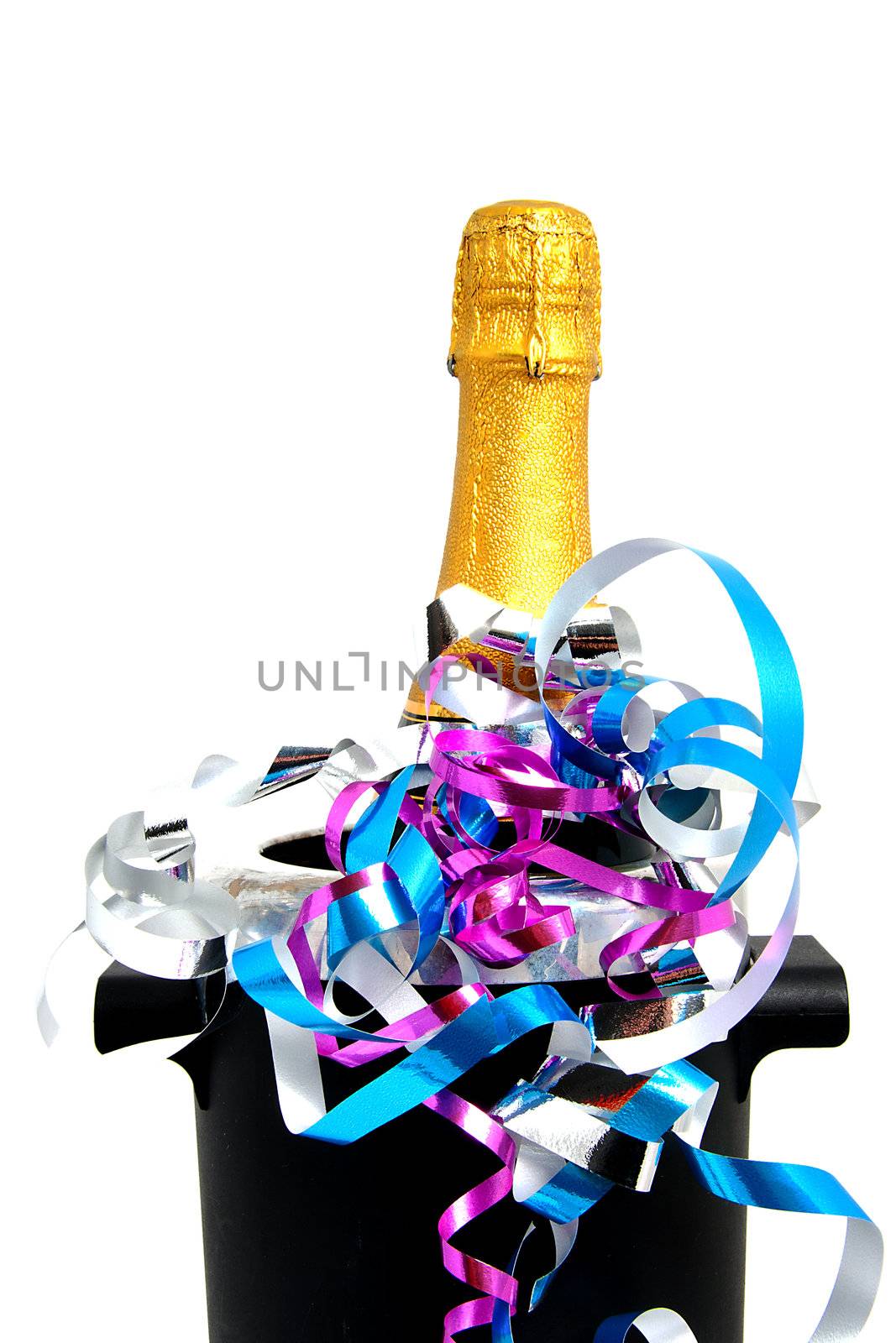 Neck of closed champagne bottle packed in golden paper witk cooler and party streamers over white background