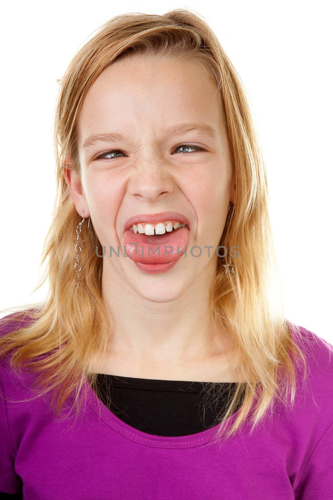 young girl makes funny face in closeup over white background