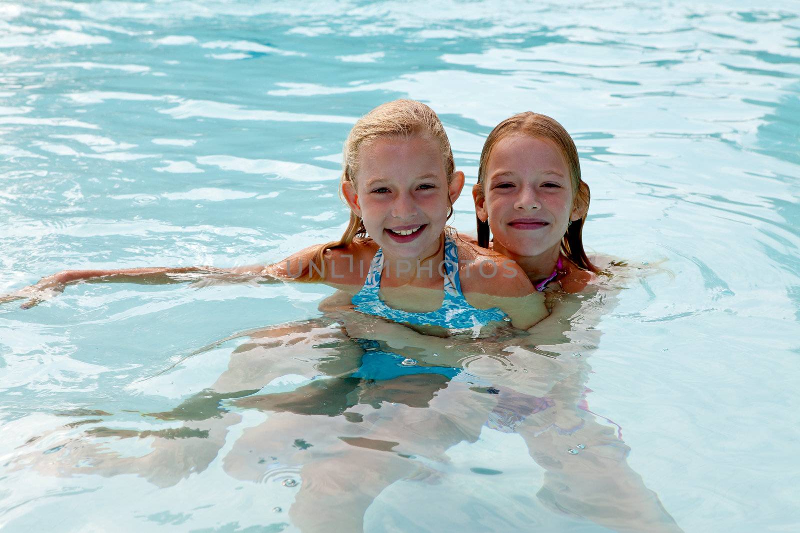 girls are heaving fun in the swim pool