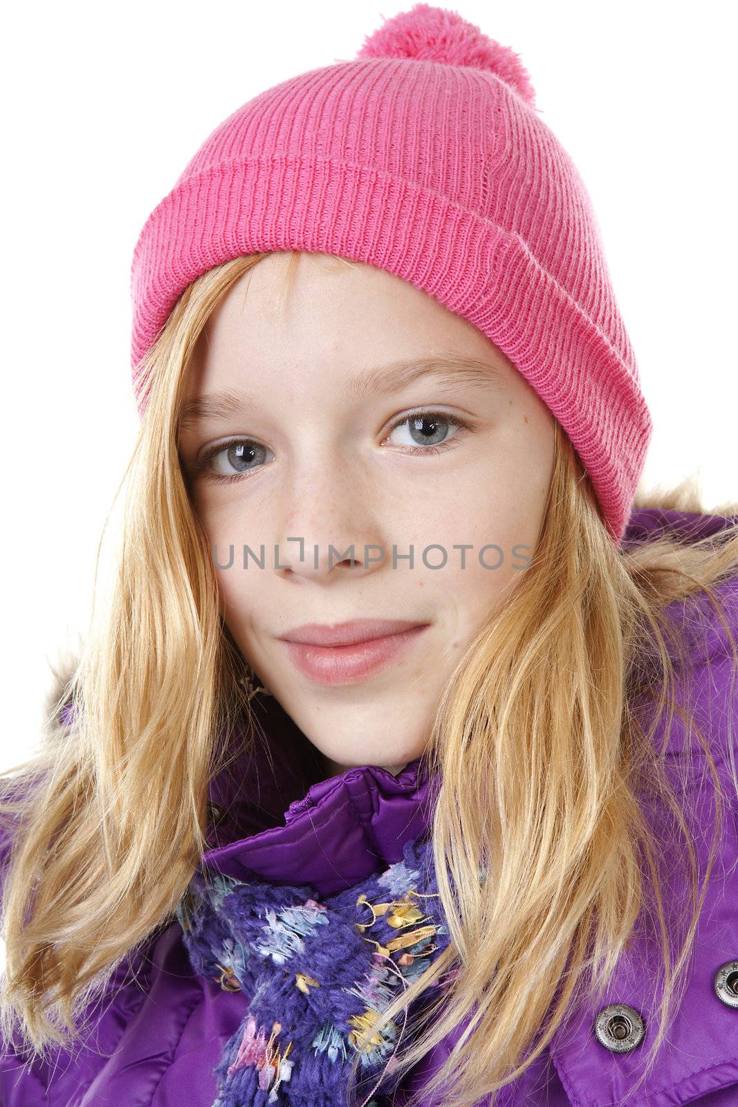 portrait of young girl in winter outfit over white background