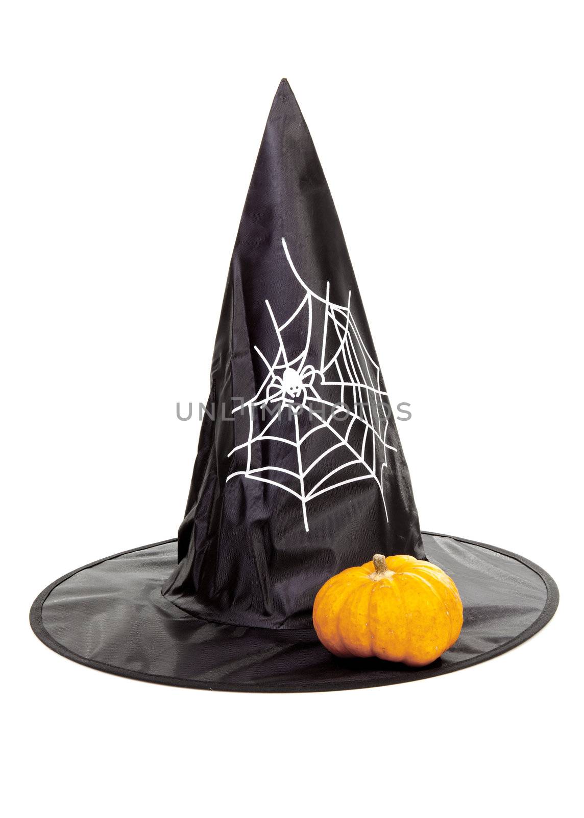 Black fabric witch hat with pumpkin for Halloween, isolated on white background
