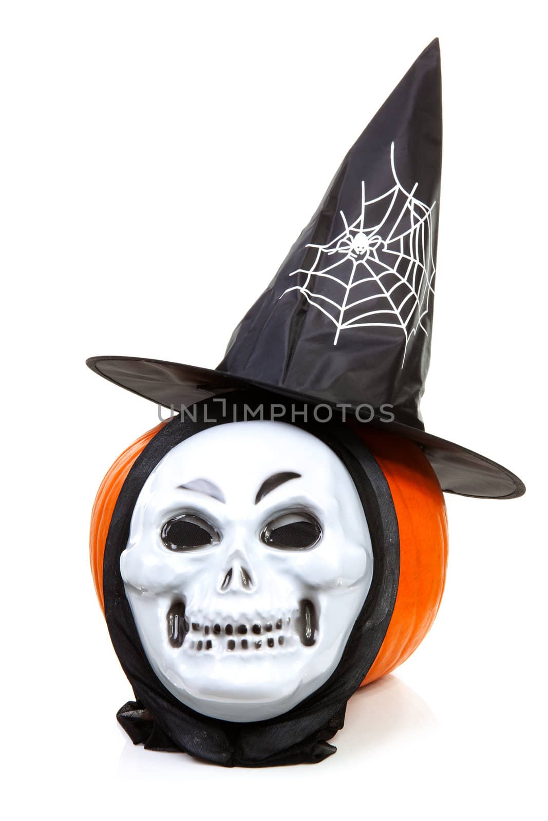 pumpkin with witch hat and scary mask over white background