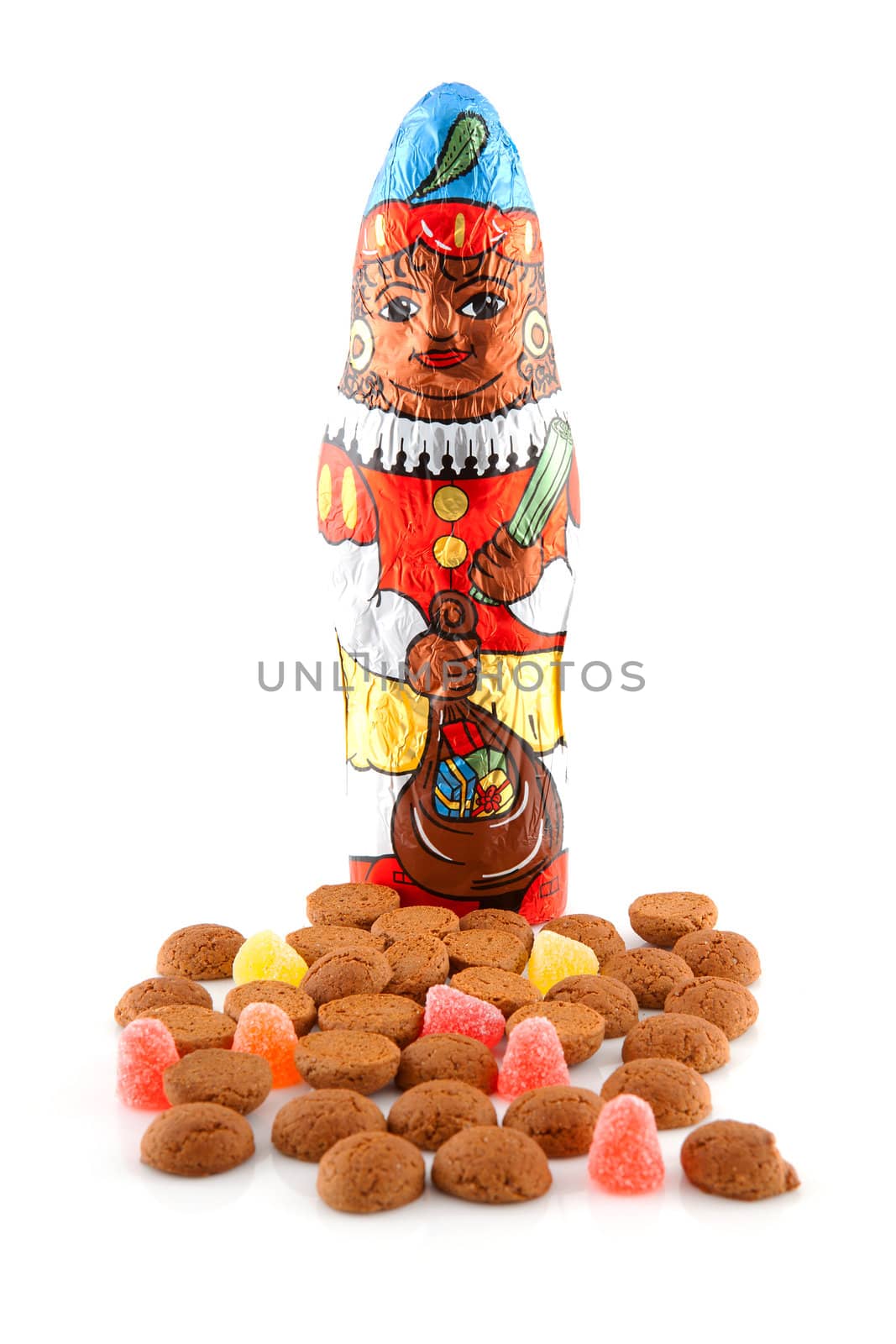 Typical dutch sweets: pepernoten (ginger nuts) and chocolate black pete ( zwarte piet) for celebration at 5 december in the Netherlands over white background