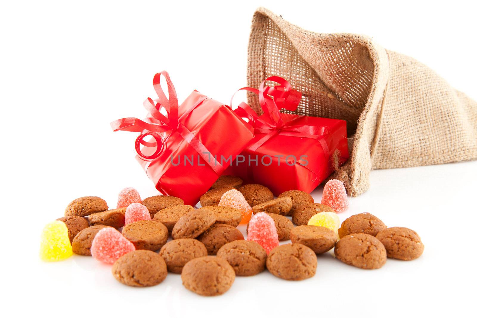 Typical Dutch celebration: Sinterklaas with surprises in bag and ginger nuts, ready for the kids in december. Isolated on white background