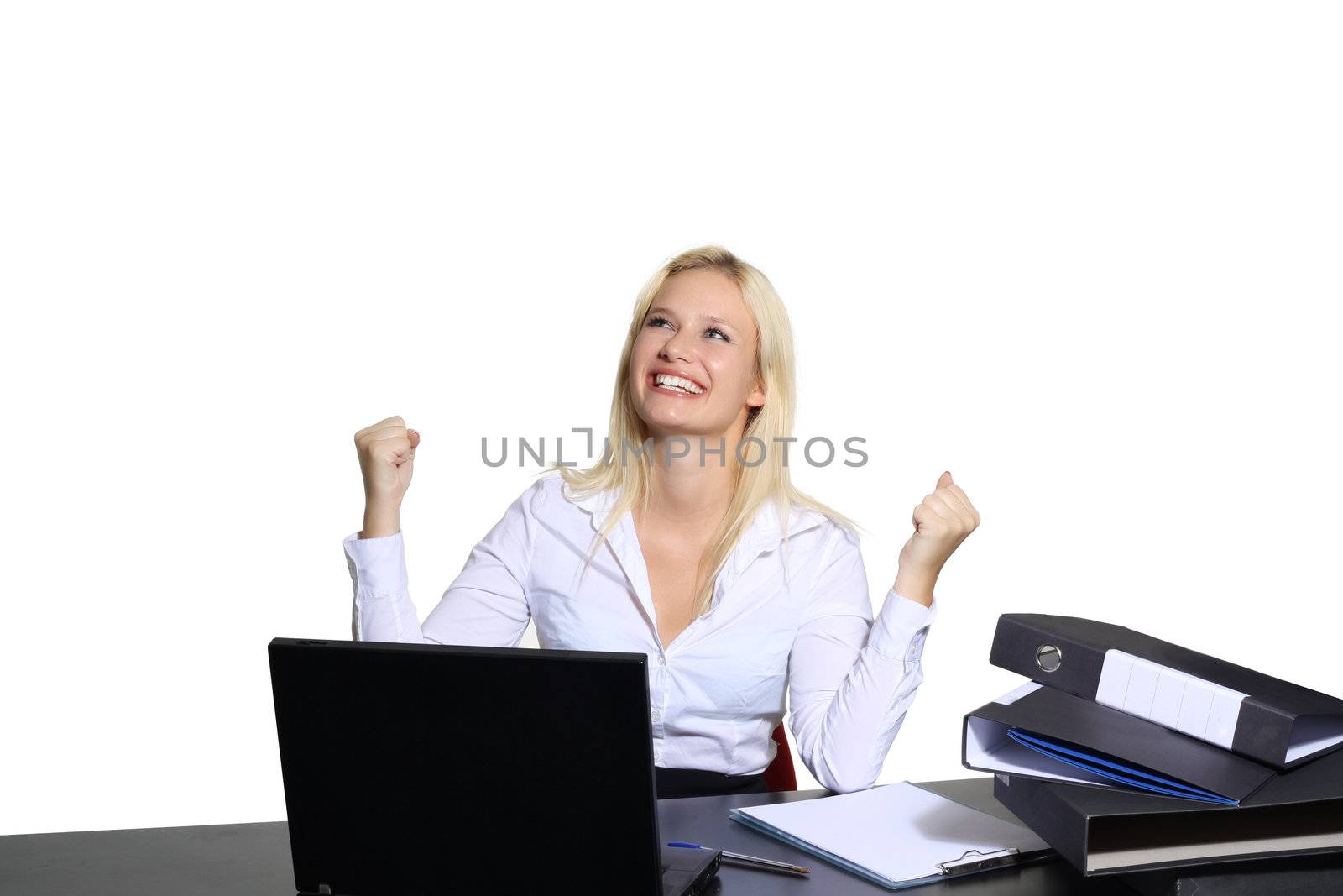 Beautiful young businesswoman in her office triumphant by icephotos