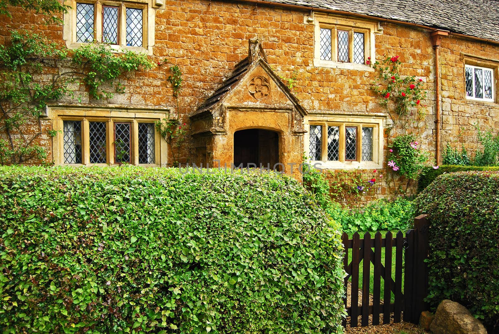 Old country stone house hedgerow wooden door