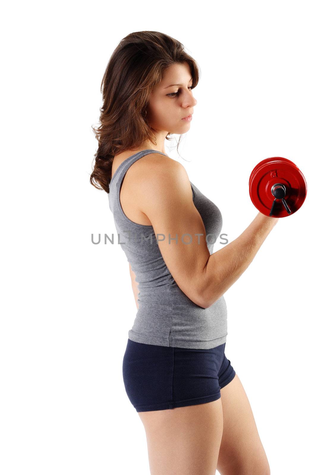 Portrait of a girl exercising with barbell