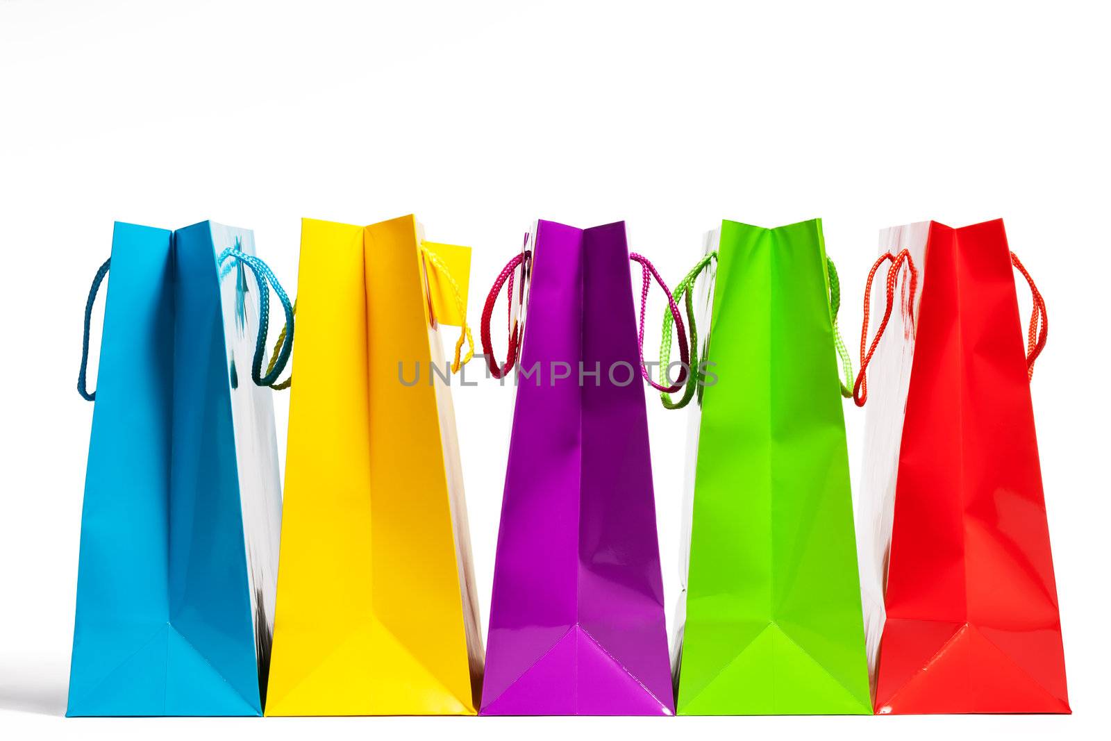 four shopping bags in a row on white background