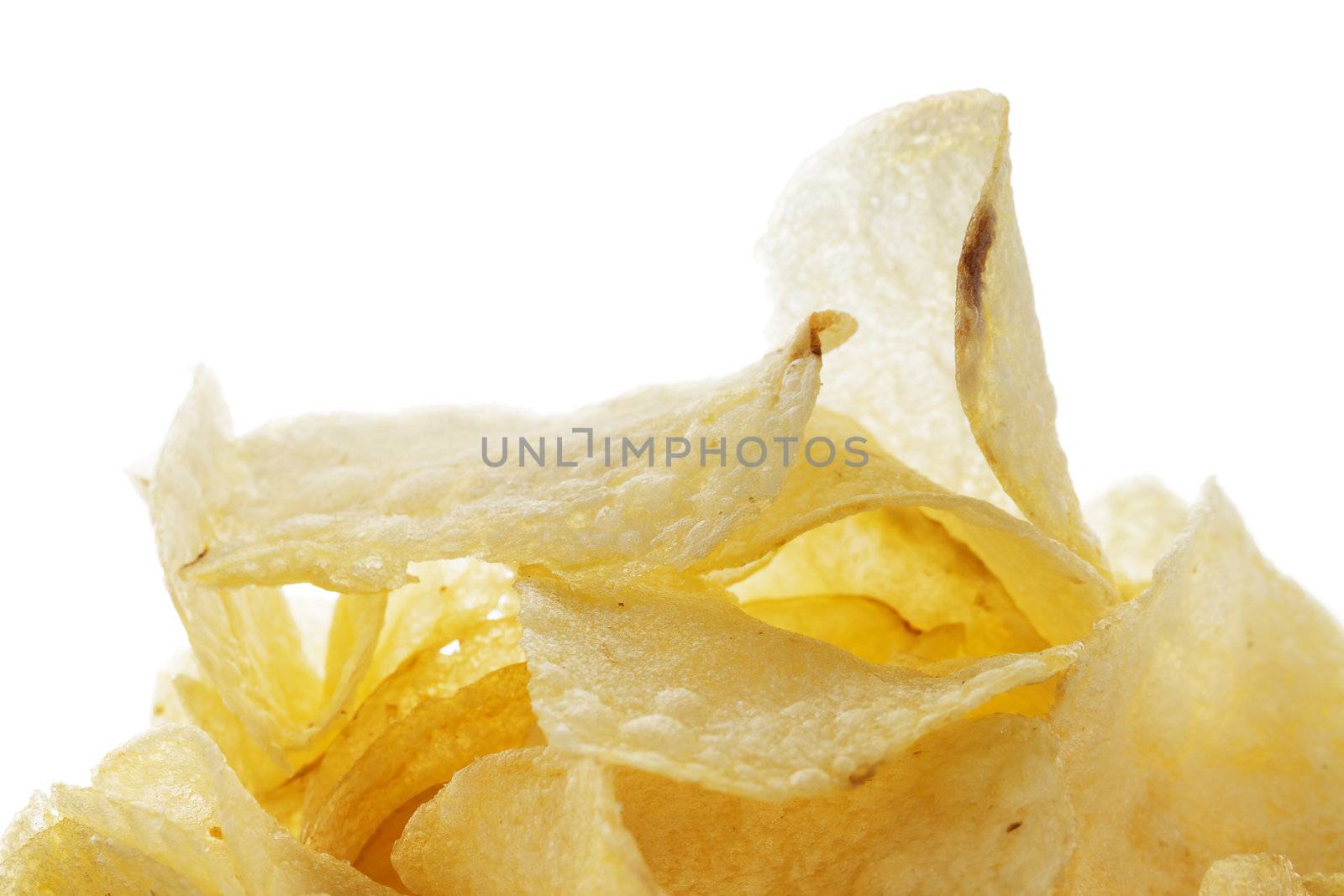 closeup of salted potato chips on white background