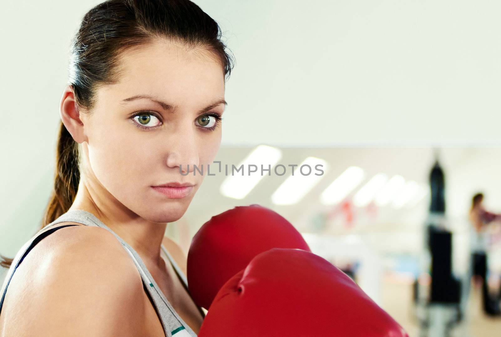 Boxer woman during boxing exercise