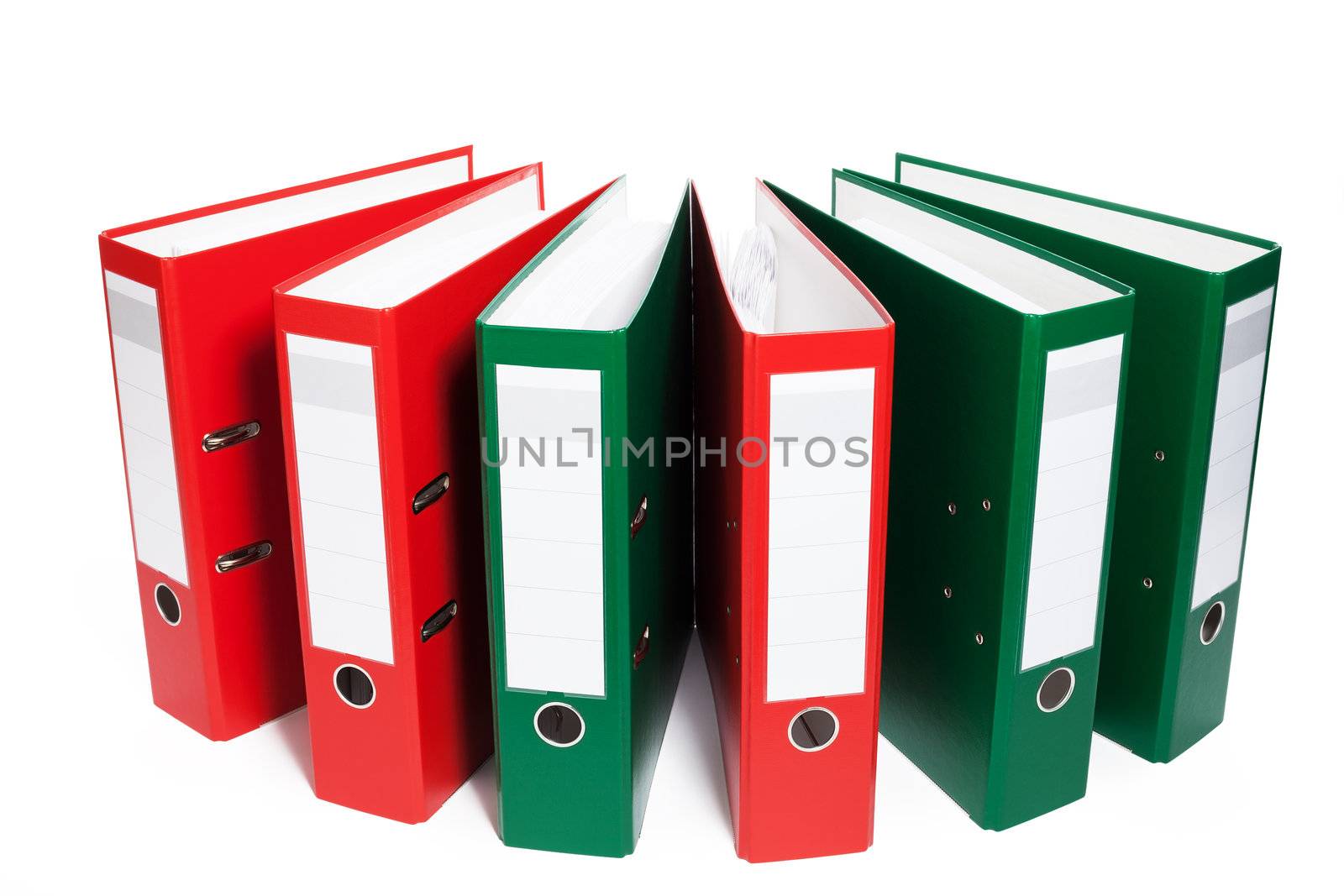 half circle of red and green ring binders on white background