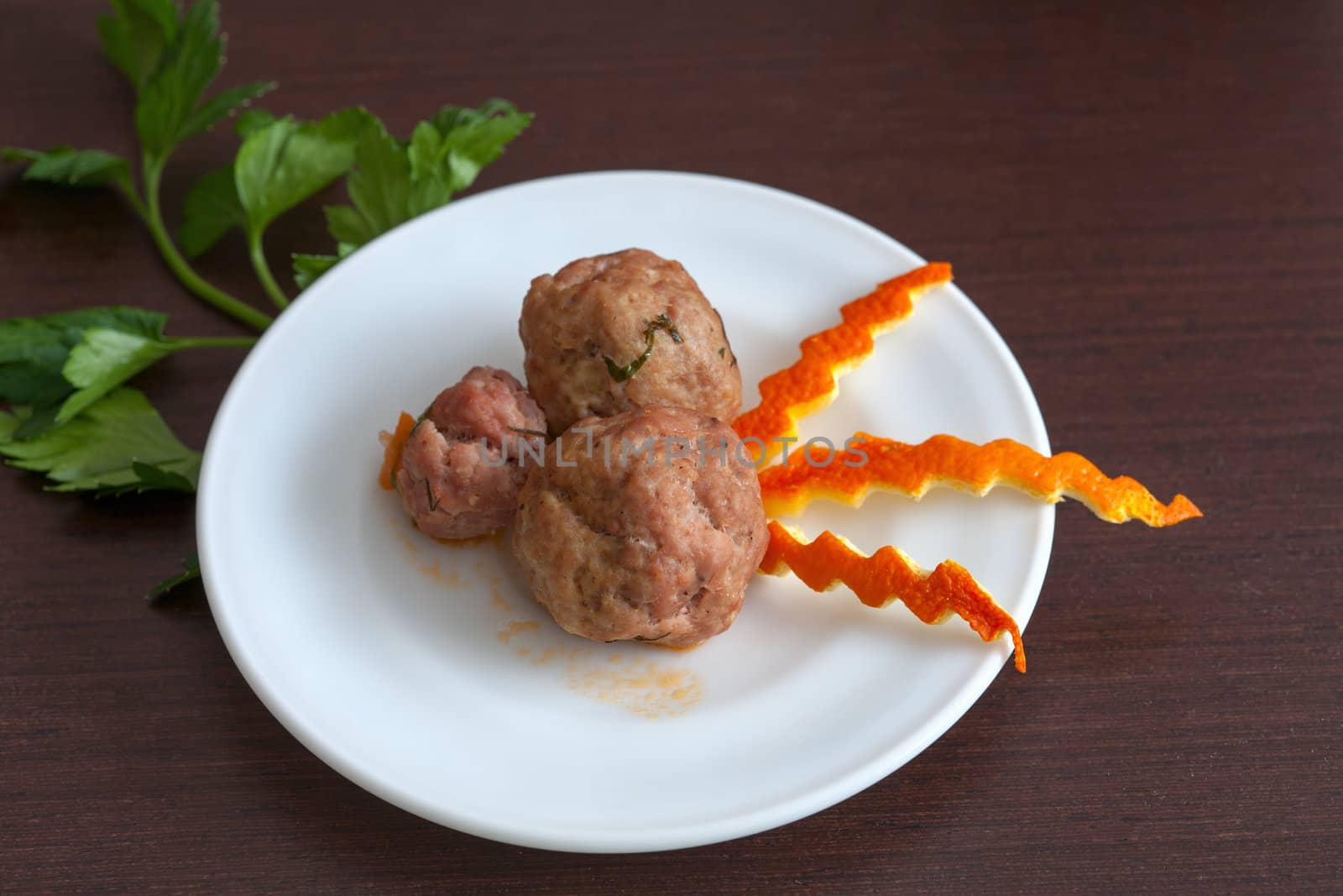 meatballs with parsley on a plate by sfinks