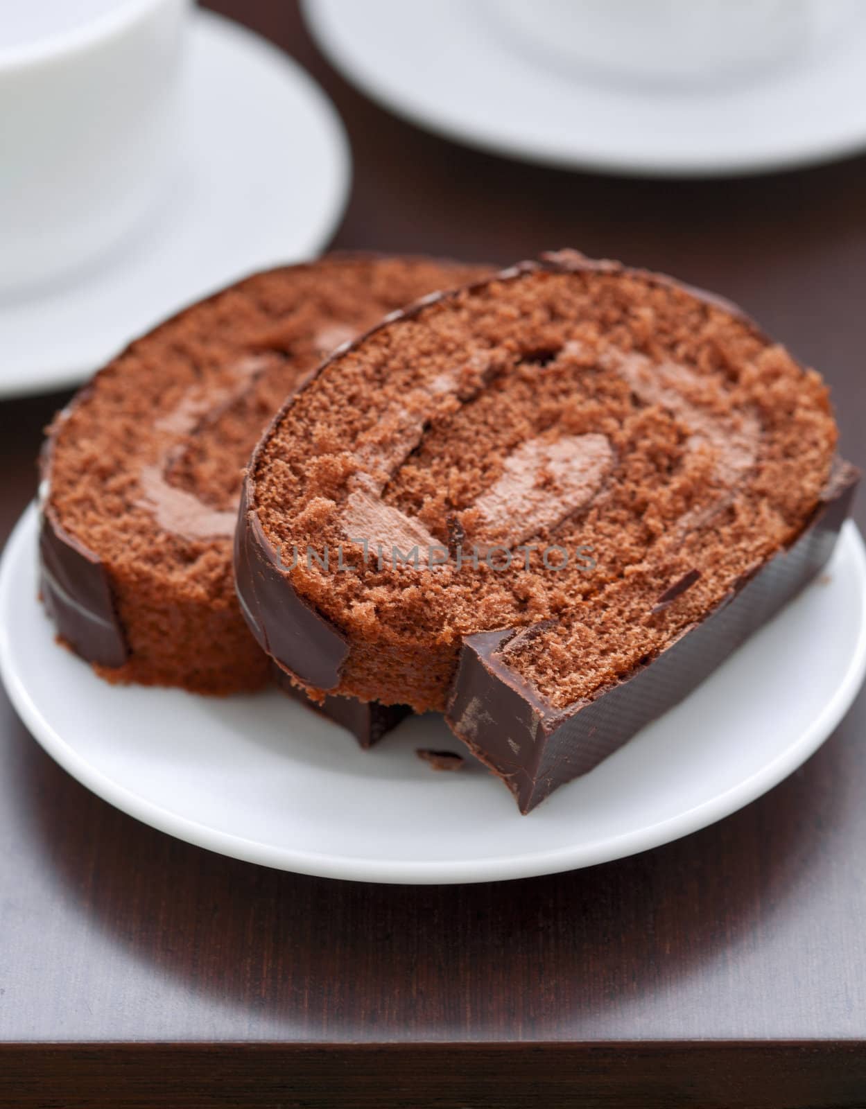 chocolate cake on a plate by sfinks