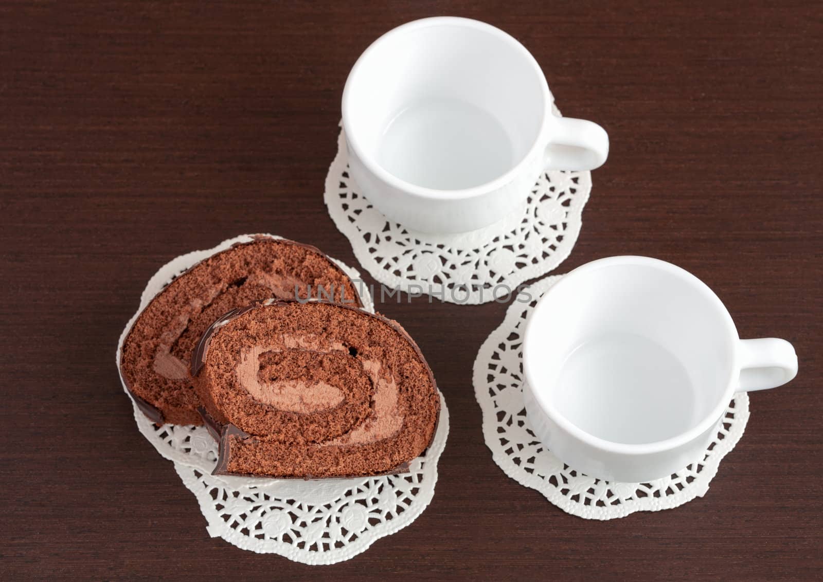 chocolate roll on napkins and cup by sfinks