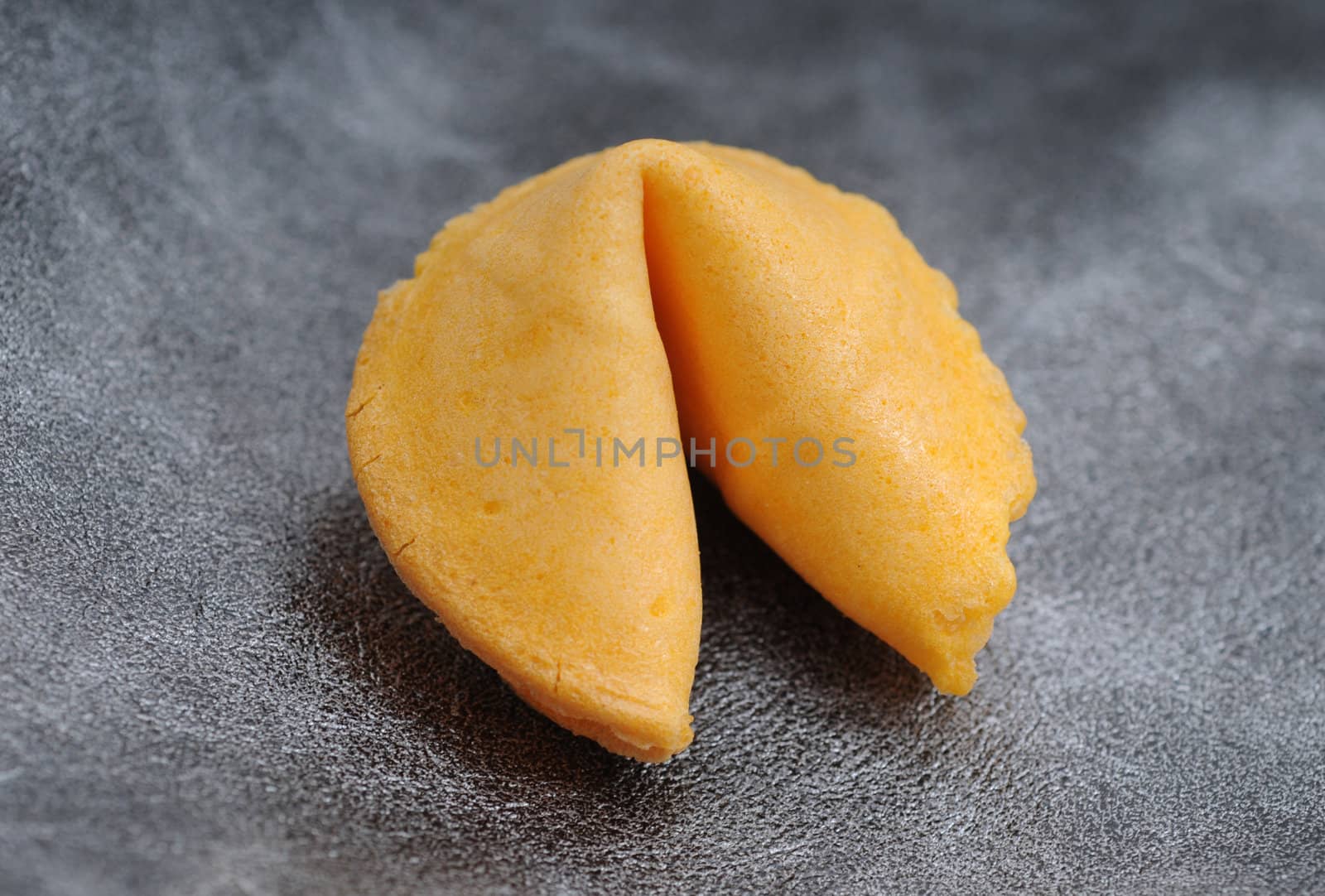 fortune cookie on gray textured background