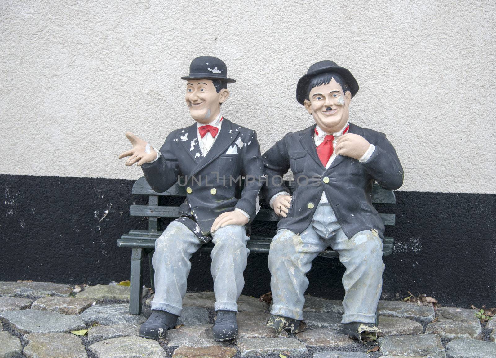 funny Laurel and hardy on a bench in garden