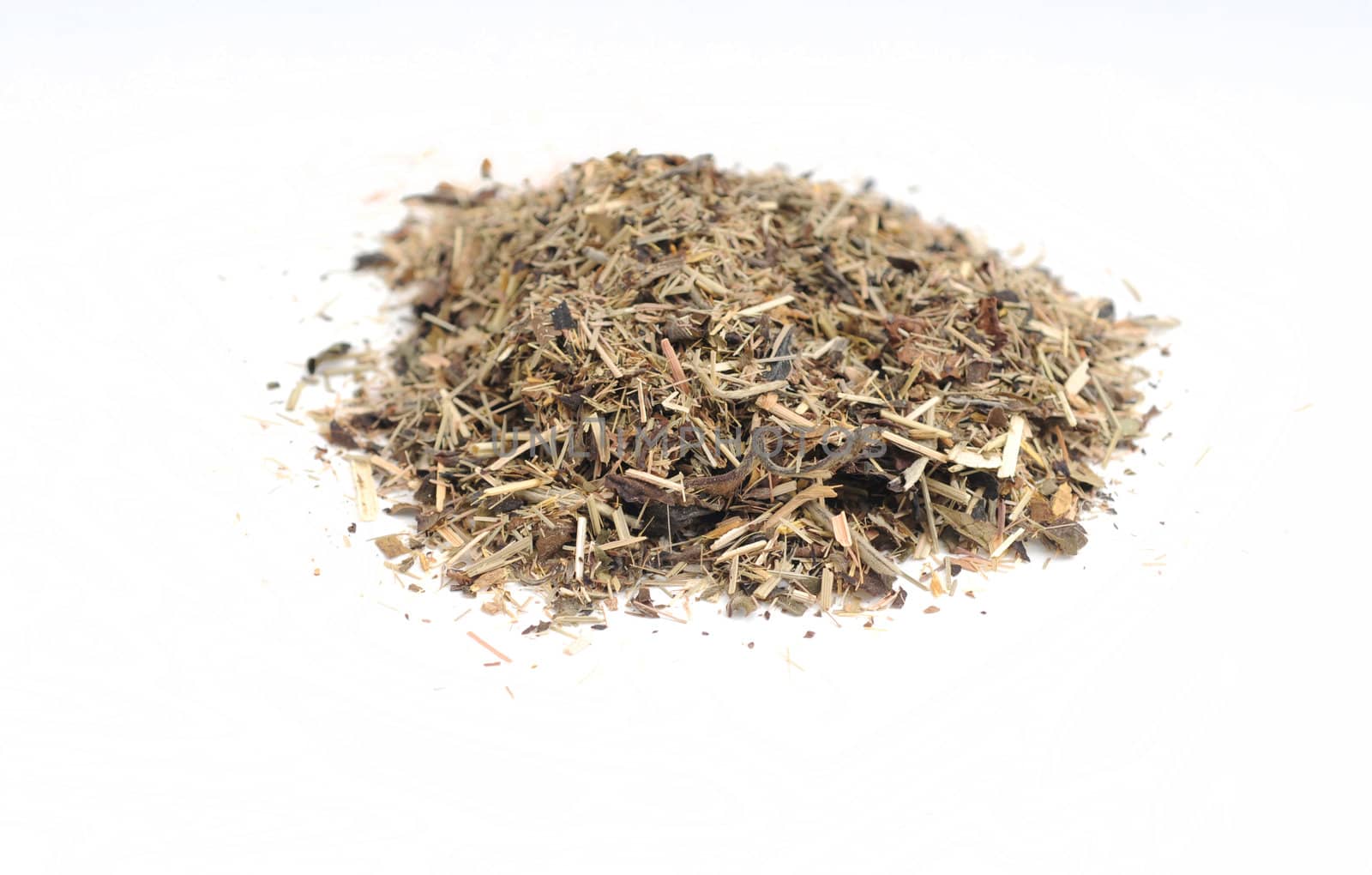 a heaping pile of white and green tea leaves