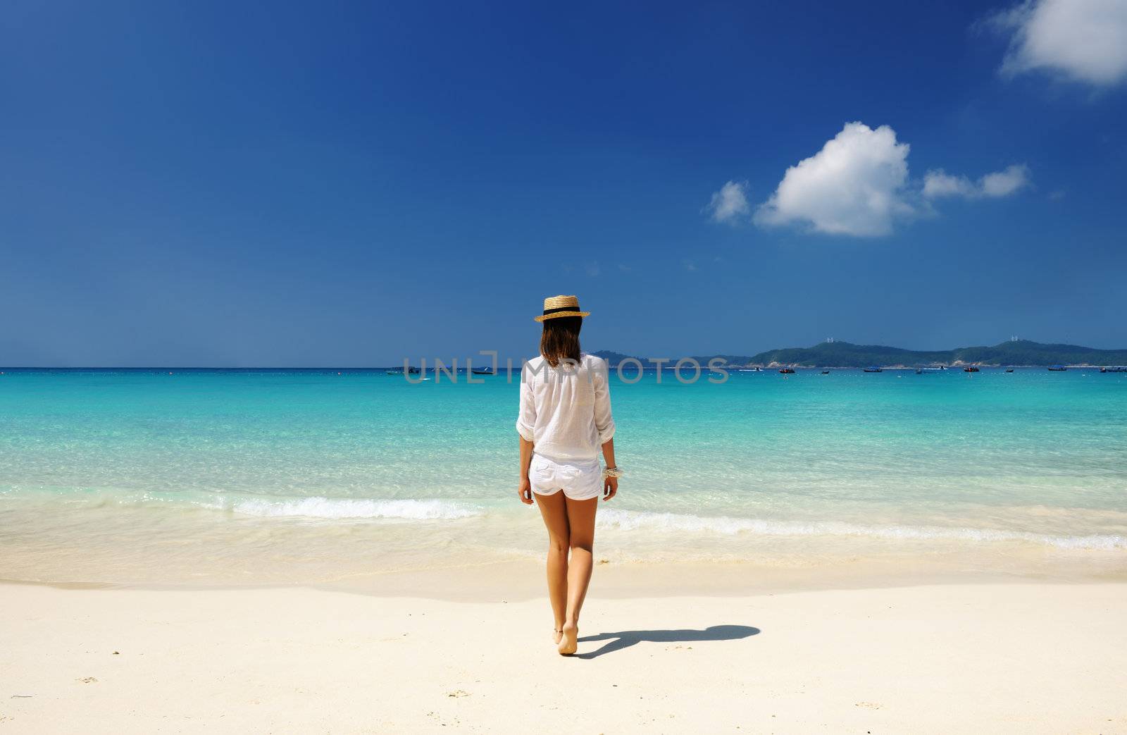 Woman in hat at beach