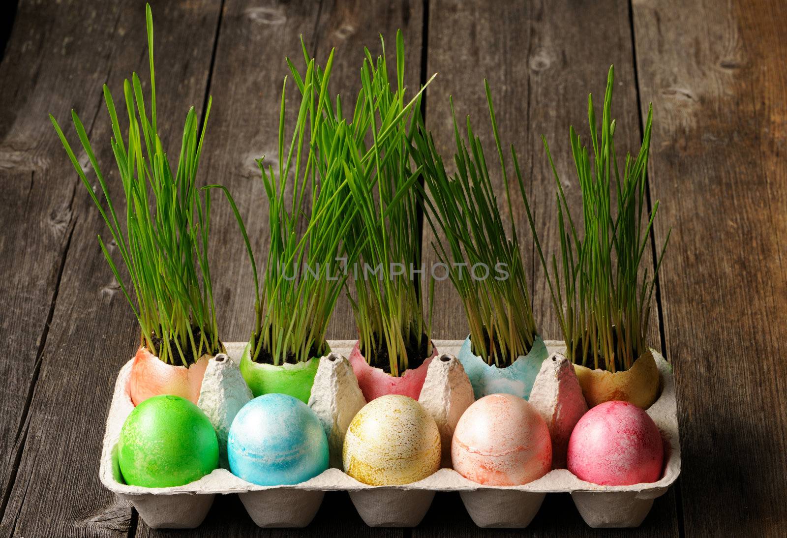 Colored easter eggs on wooden table