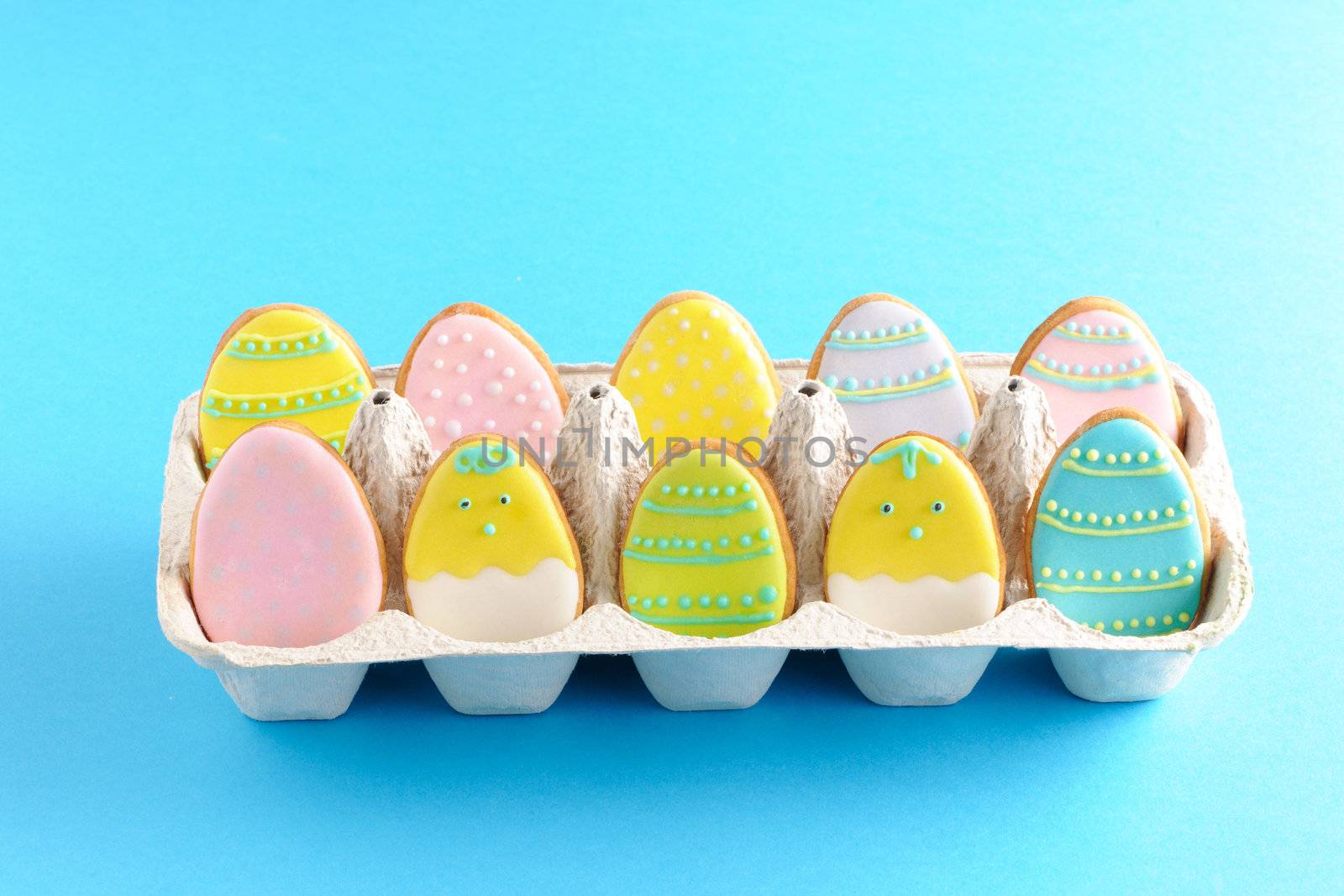 Easter homemade gingerbread cookie over blue