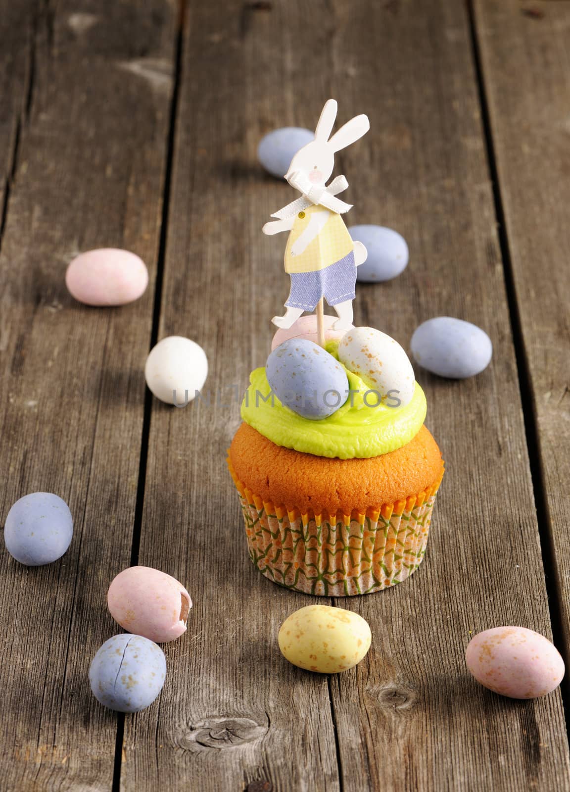 Easter homemade cupcake over wooden table