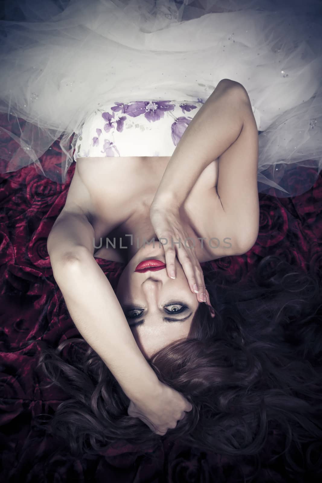 Red Hair. Fashion Girl Portrait. Attractive sad woman lying on t by FernandoCortes