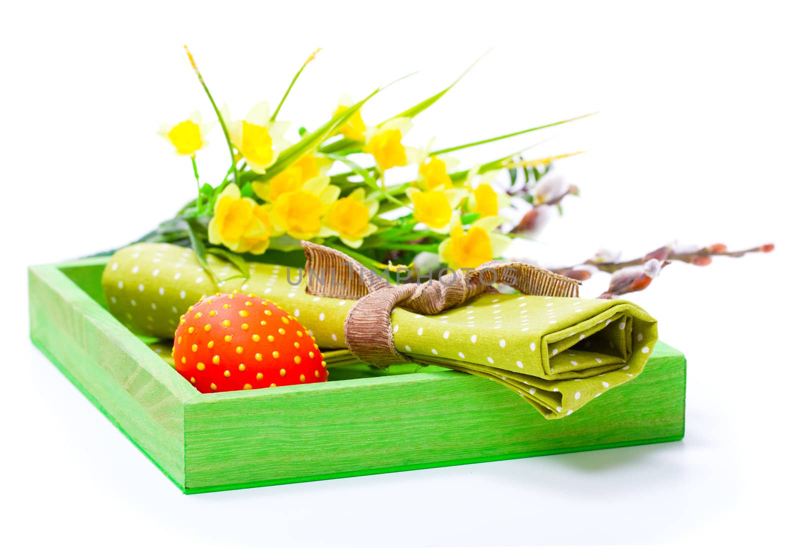 Easter egg with a serviette, in a tray for breakfast. isolated on white background.