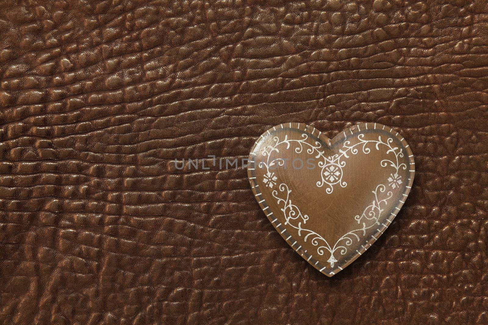Heart on leather background by sumners