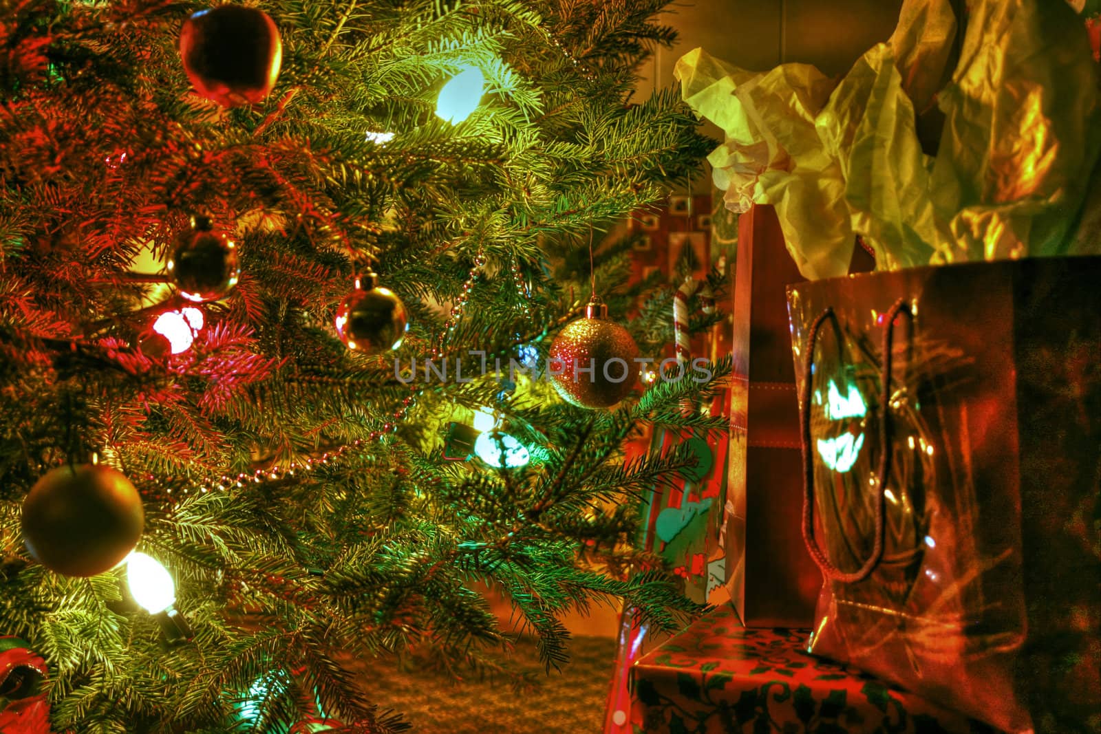 Wraped gifts under a Christmas tree and decorations