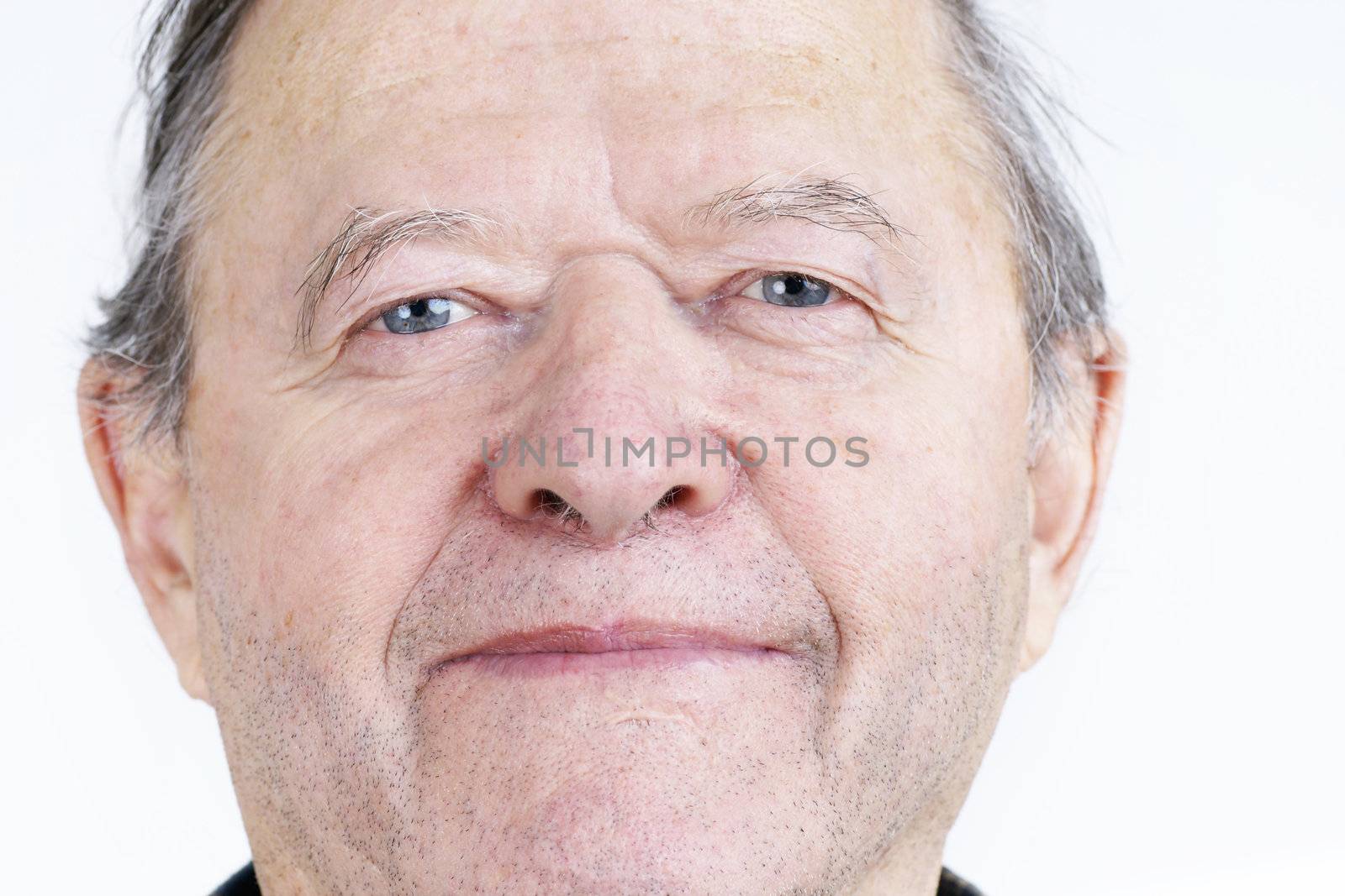 Candid portrait of real person, a smiling senior citizen or old man, no retouching great details.
