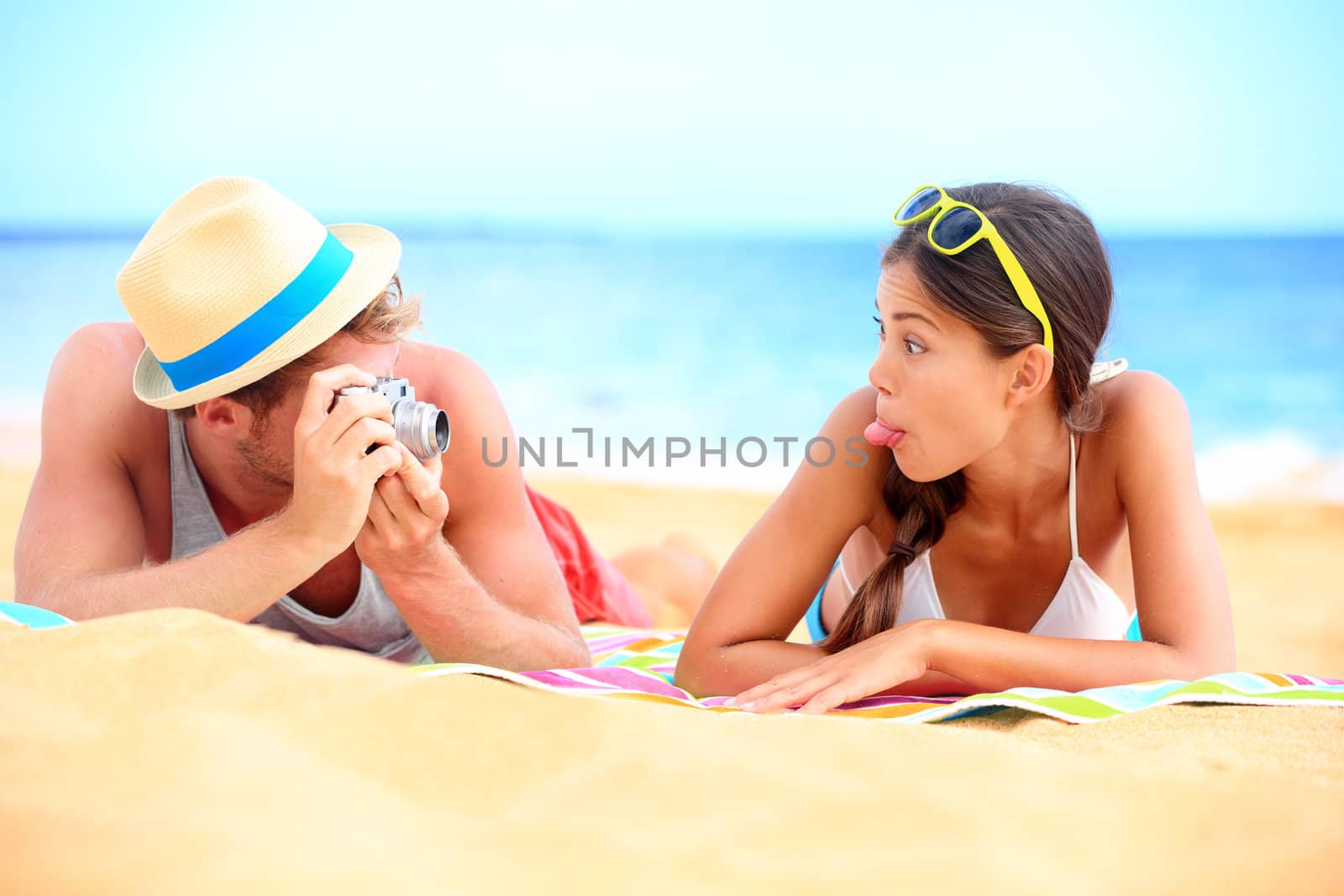 Young couple having fun on beach by Maridav