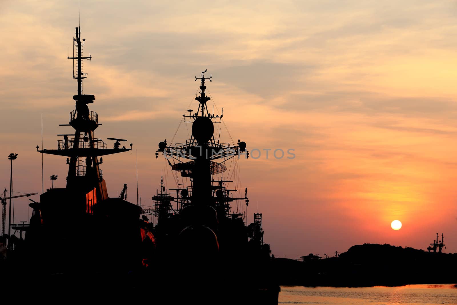 battleship with sunset behind