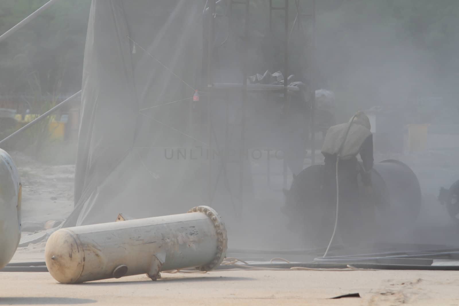 Sandblasting of metal structures at construction site