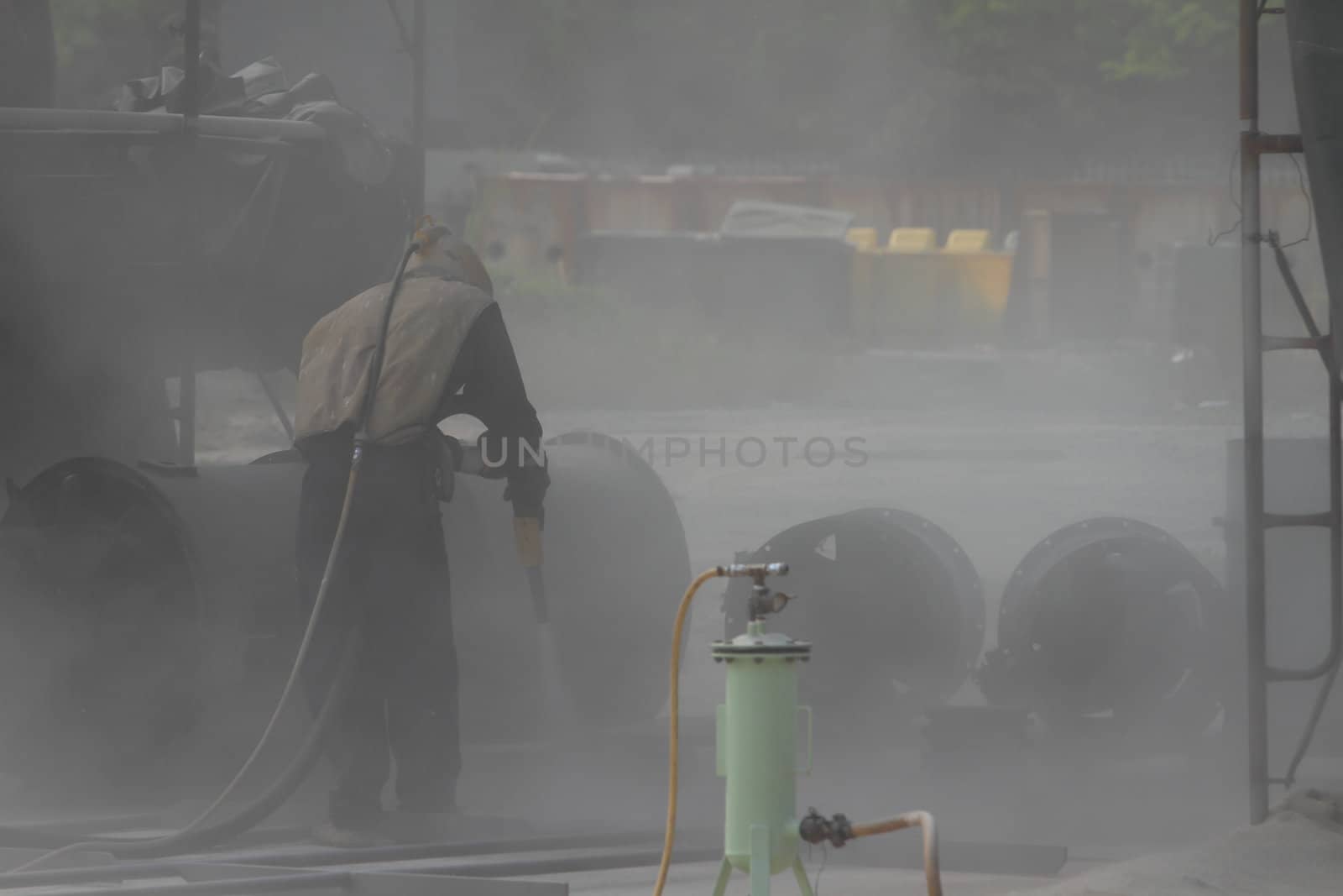 Sandblasting of metal structures at construction site