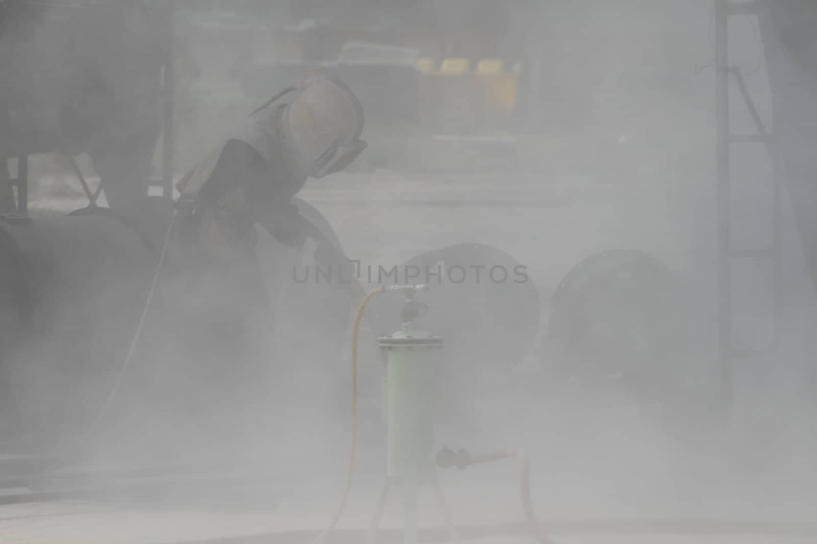 Sandblasting of metal structures at construction site