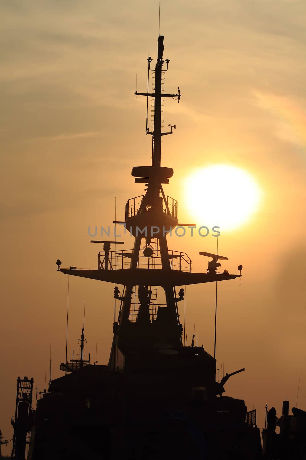 battleship with sunset behind