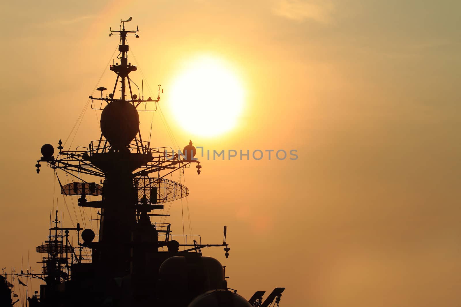 battleship with sunset behind