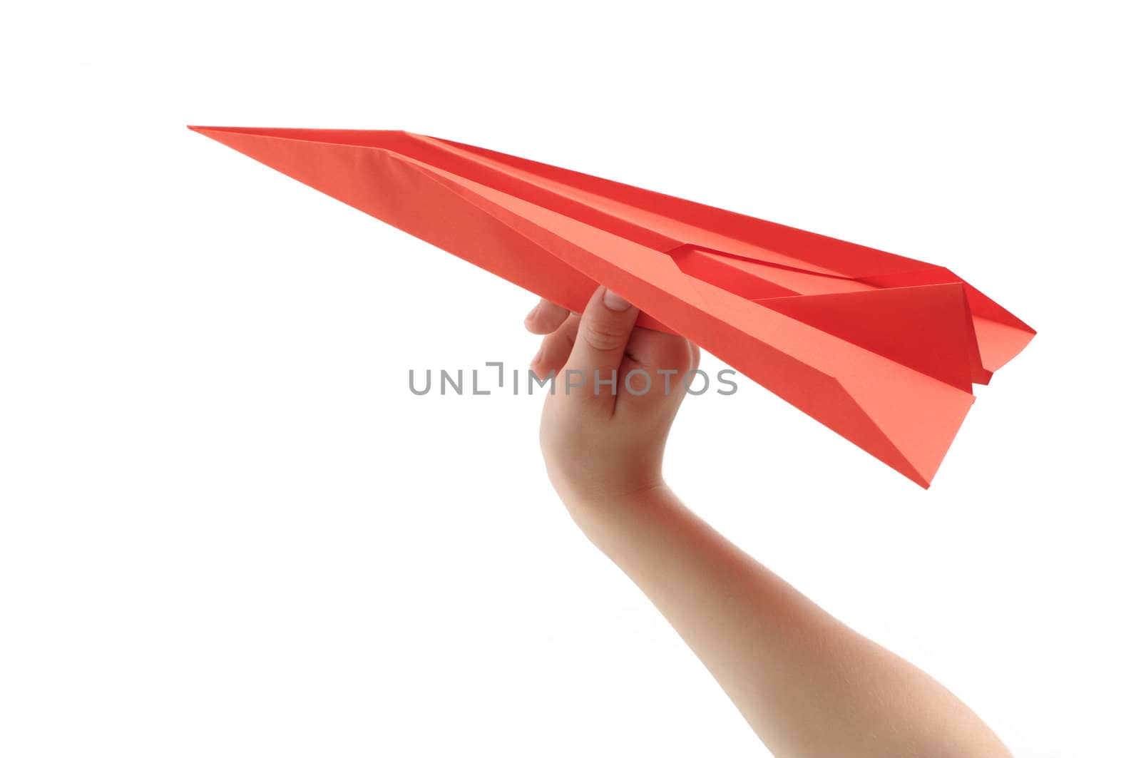 Child's hand launching paper airplane by DNKSTUDIO