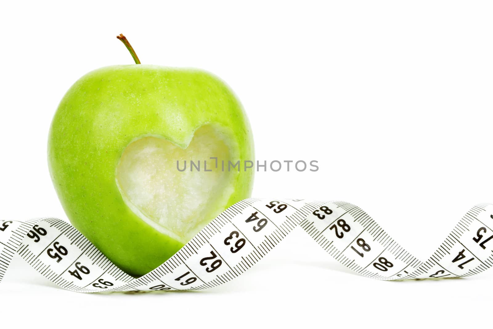 green apple with a measuring tape and heart symbol isolated on white background 