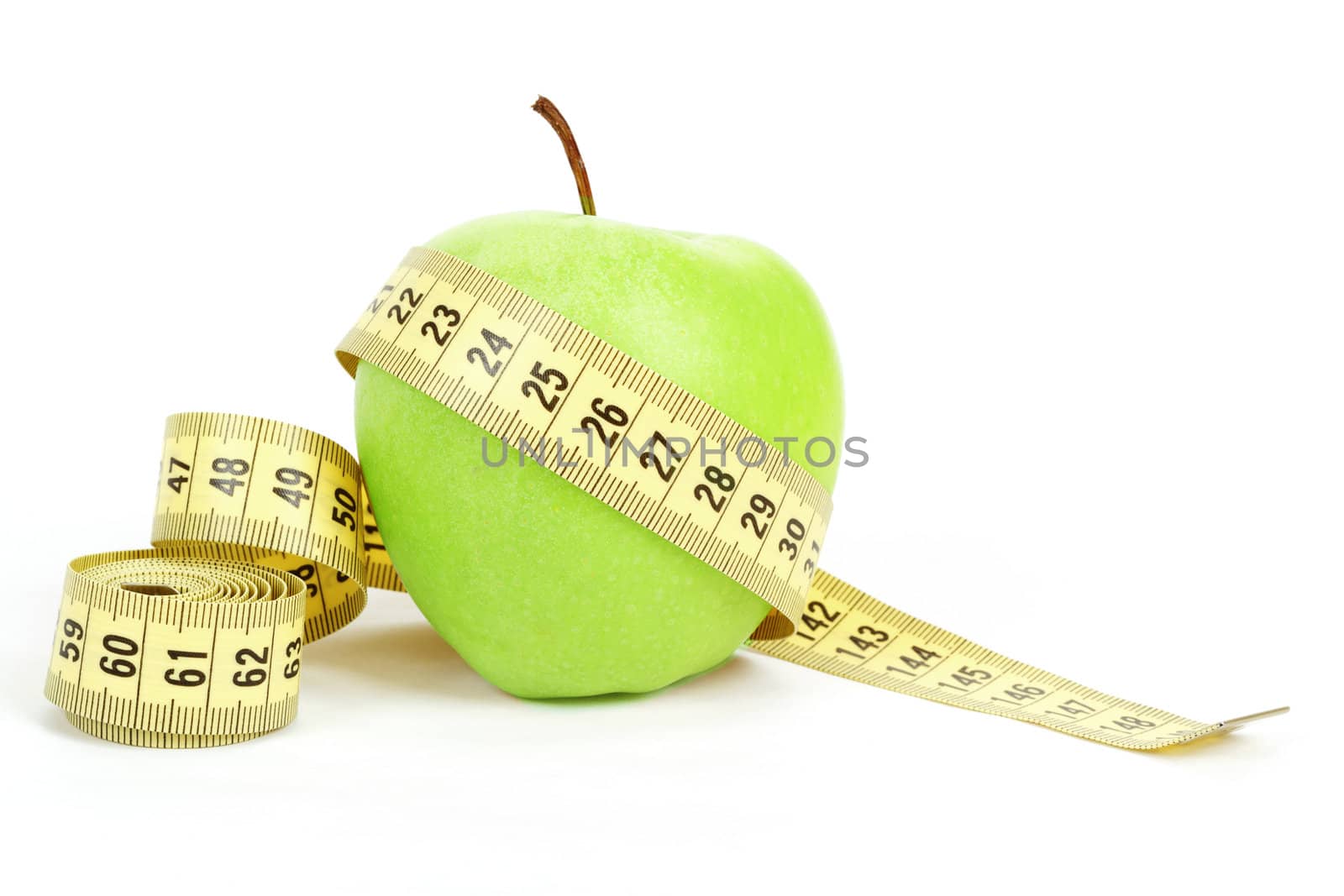Green apple and yellow measuring tape isolated on white background