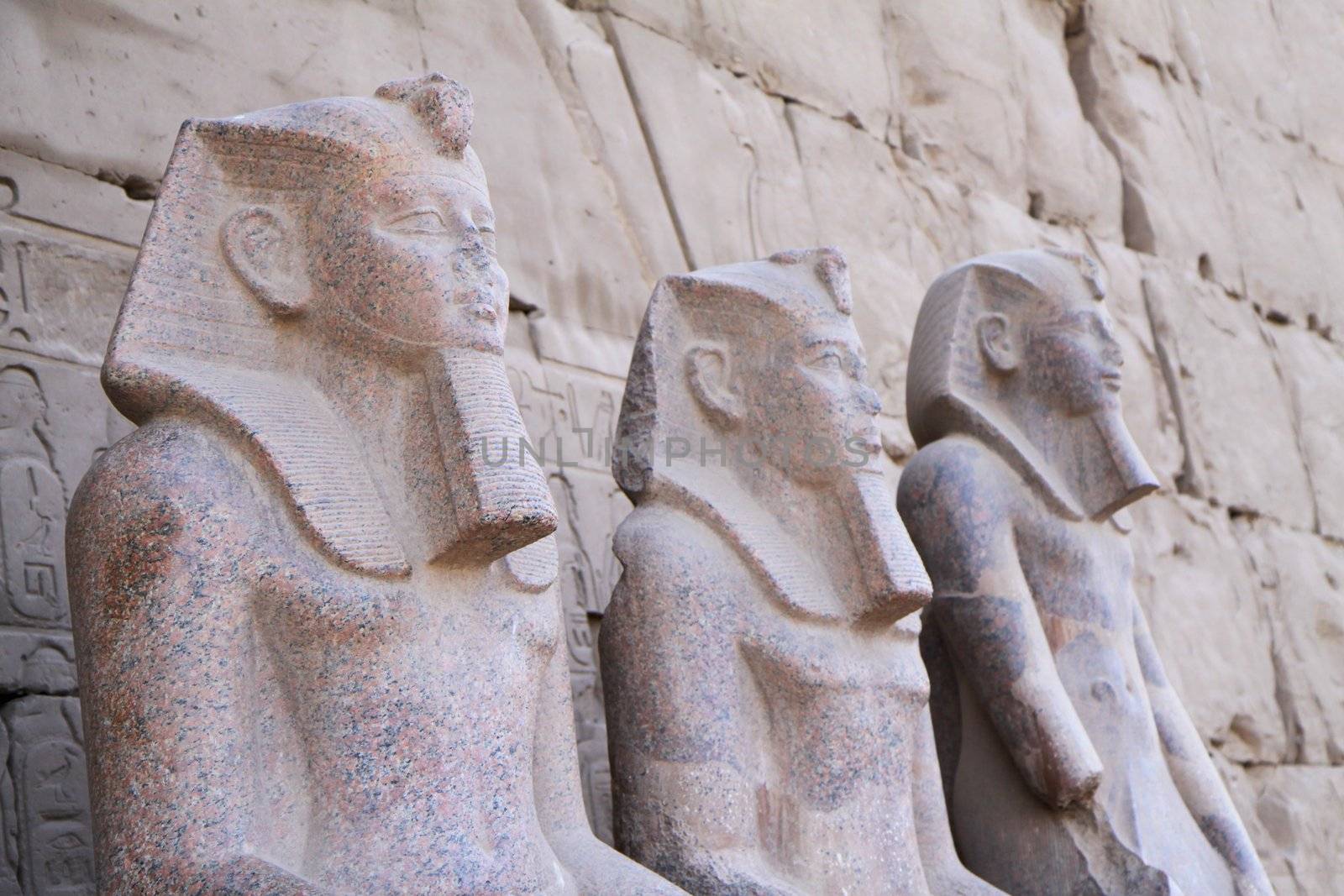 Three granite statues by Gbuglok