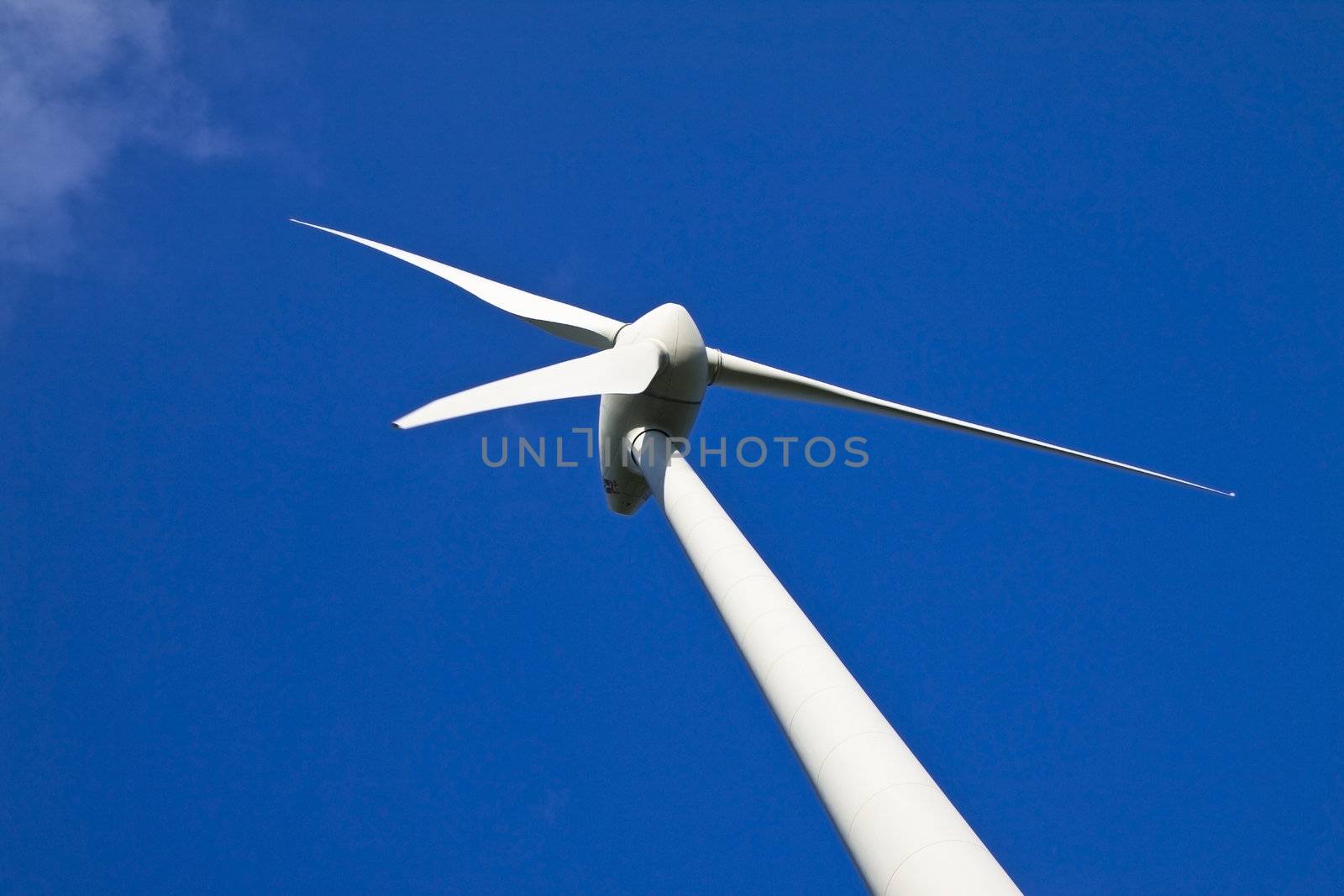 Windmill against a blue sky, alternative energy source